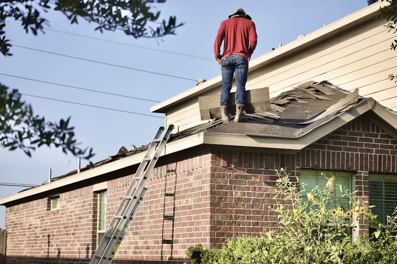 Professional roofer working on a residential roof in Hogestown